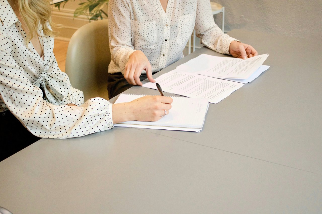 An image illustrating agents reviewing documentation