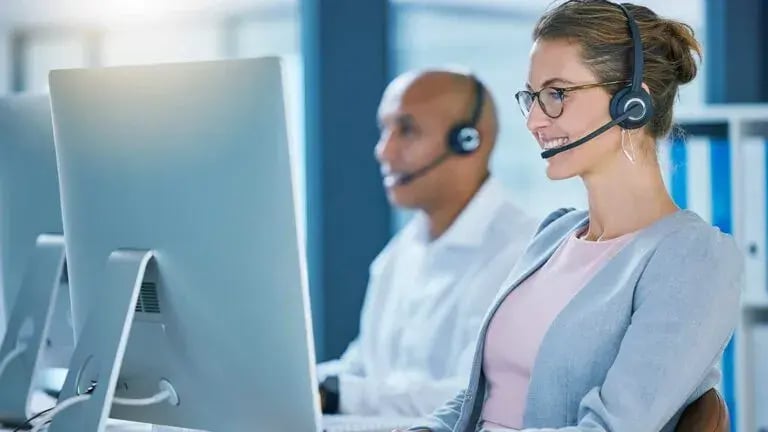 Insurance agent receiving a live phone call from a prospective business insurance customer.