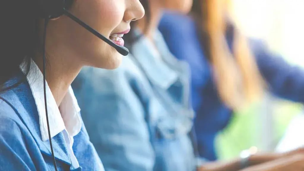 cold-calling-insurance-agentInsurance sales agent making a cold call from a desk, representing outbound phone marketing to business prospects.