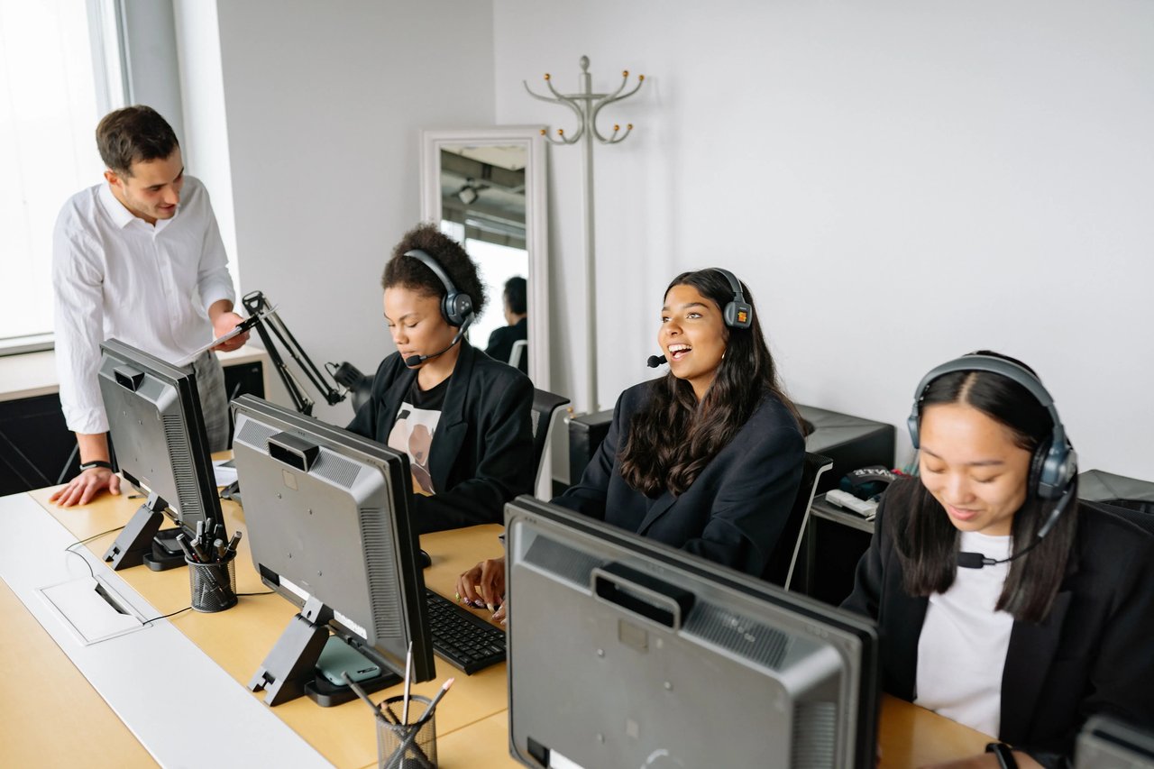 Sales manager reviewing performance metrics with a sales representative during an accountability meeting, using data to discuss expectations, transparency, and consistent performance standards.