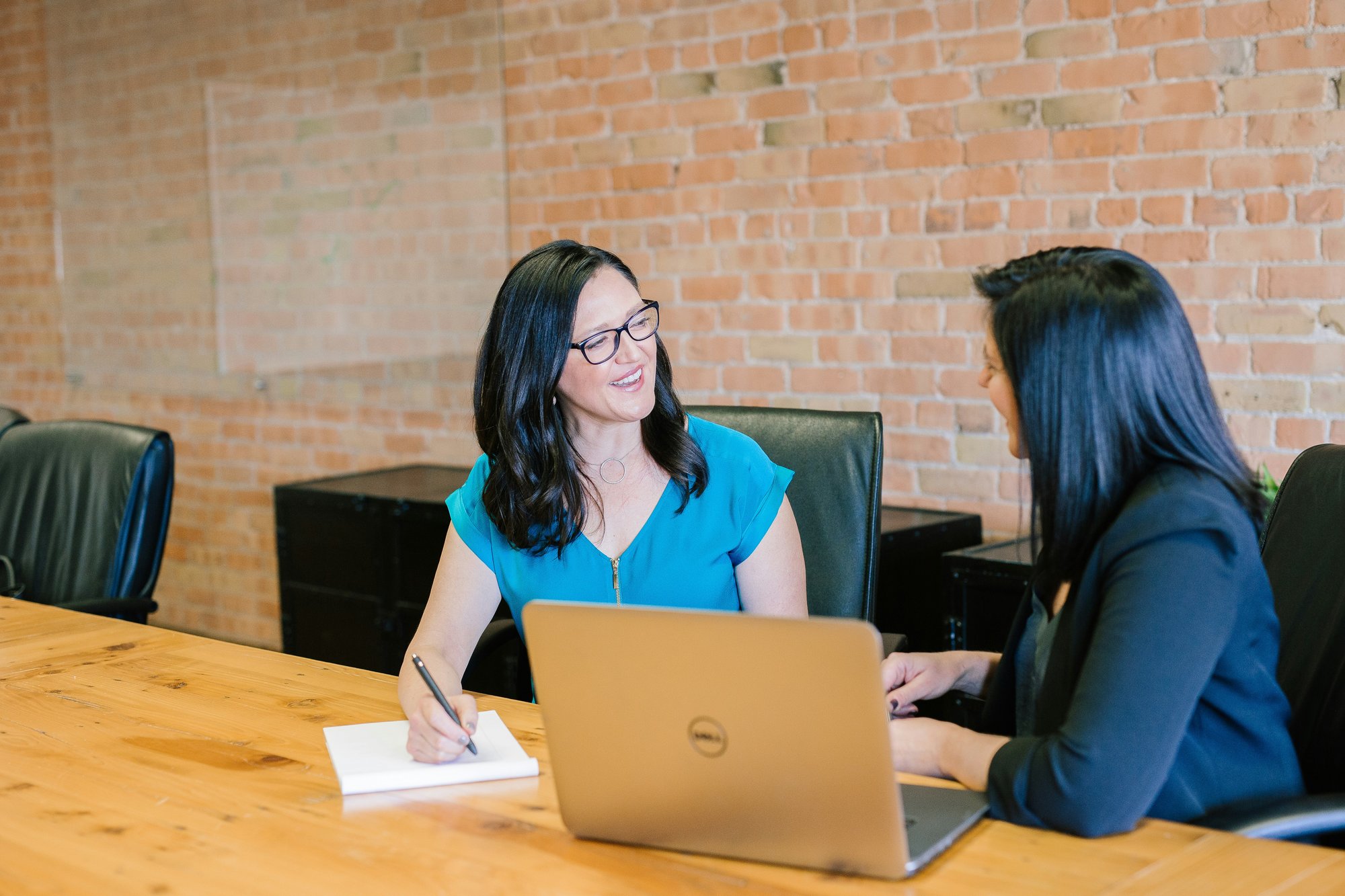 Sales manager giving timely feedback to a sales representative during a coaching session, illustrating how consistent daily coaching prevents poor habits from becoming long-term performance problems.