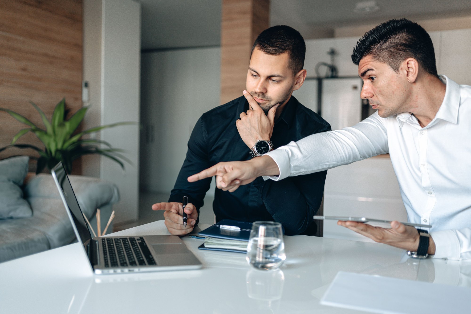 Newly promoted sales manager reviewing team performance metrics, KPI dashboards, and coaching plans to develop data-driven leadership and improve team results.