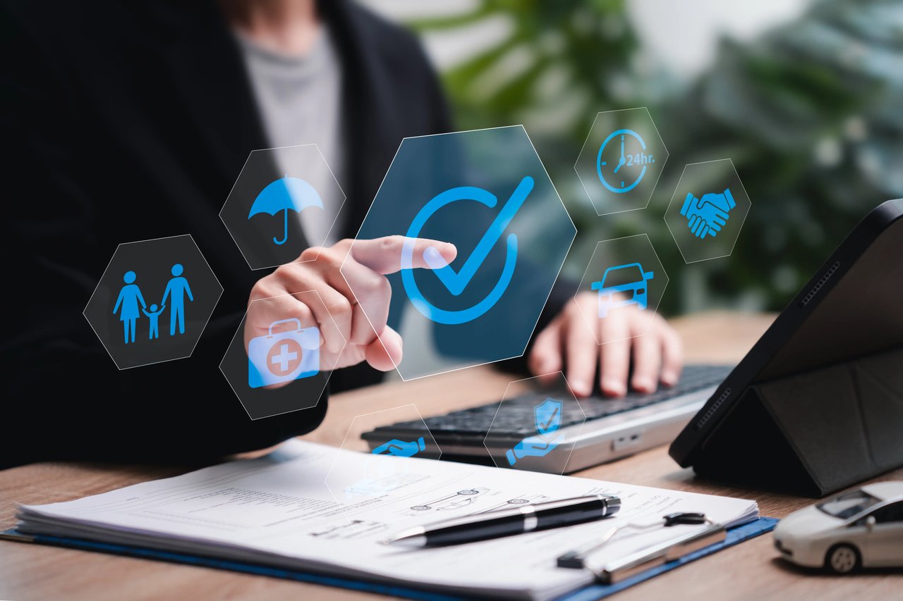 Insurance agency owner reviewing lead costs, close rates, premiums, and acquisition metrics to evaluate overall campaign profitability.