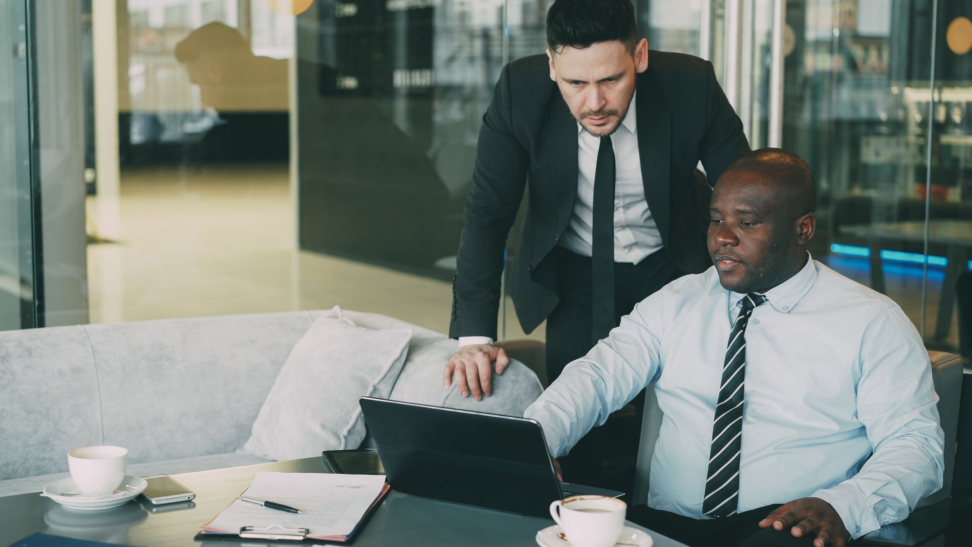 Manager having an honest career development conversation with a top-performing sales employee about leadership readiness, career growth, and long-term professional success.