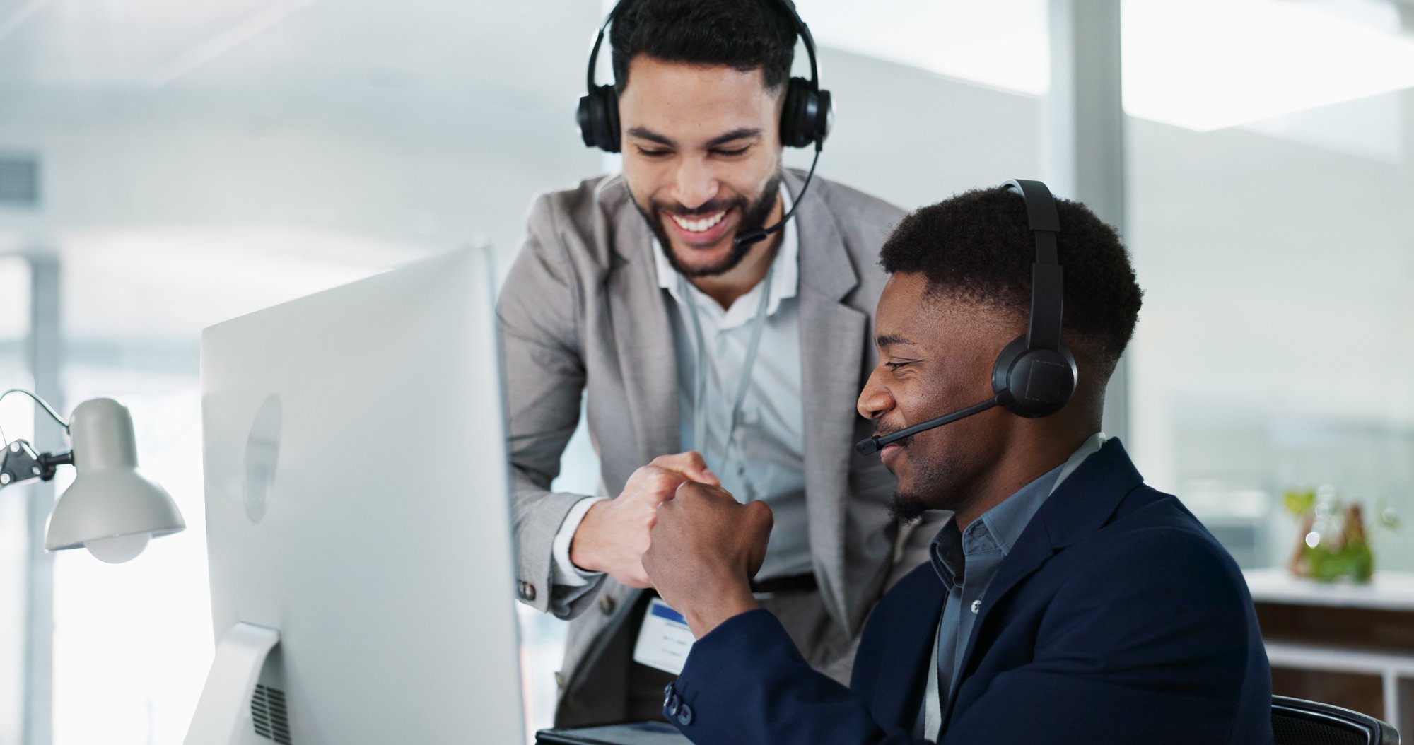 Sales manager providing personalized coaching and constructive feedback during a one-on-one meeting, emphasizing accountability, consistency, and employee development.