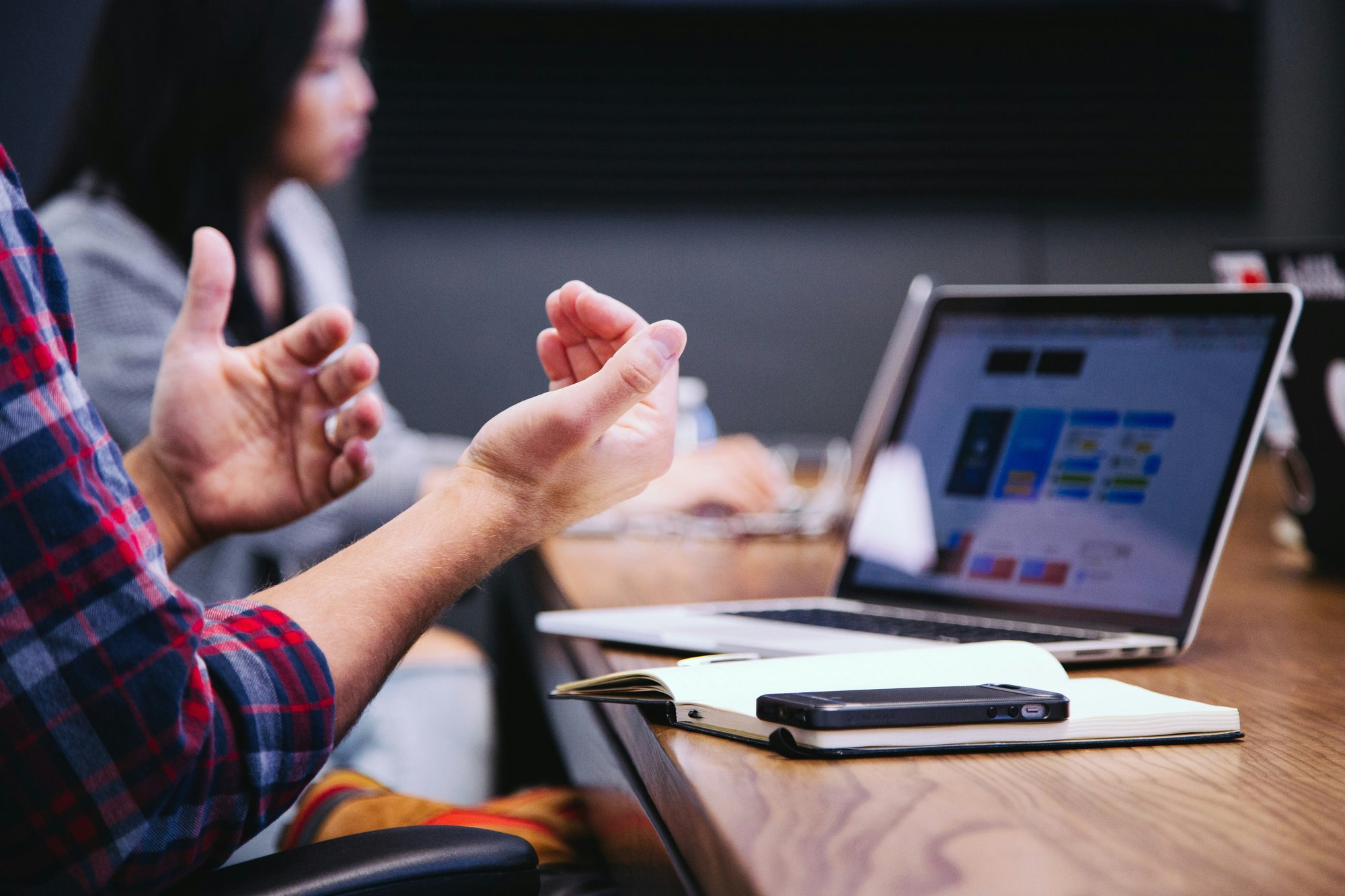 Sales manager leading a weekly one-on-one coaching session while reviewing KPI dashboards, call activity, and performance metrics with a producer.